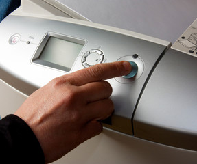 finger presses the button