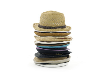 Fototapeta na wymiar Stacks of straw hats on white