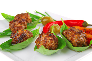grilled cutlets on basil leafs