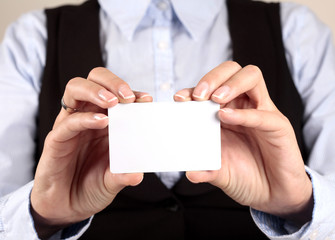Blank business card in a hand