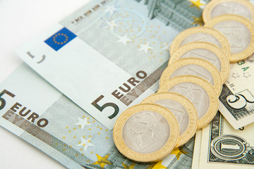 Euros and dollars isolated on white background