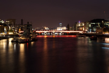 Night view of the London Bridge and the river Thames