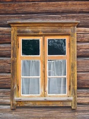 Window in old wooden wall