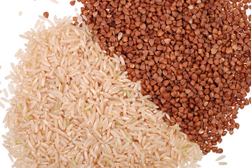 Handful of rice and buckwheat grain isolated