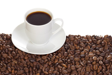 cup with coffee and beans