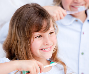 Caucasian child brushing his teeth