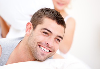 Obraz premium Handsome man lying on the bed