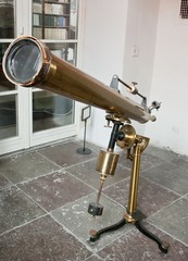 Antique mirror telescope.