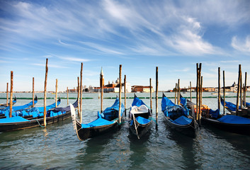 Fototapeta na wymiar Godolas in Venice in Italy
