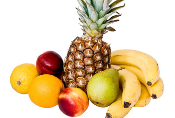 Tasty and ripe pineapple, bananas, orange and other fruits