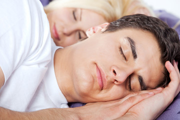 Obraz na płótnie Canvas Couple sleeping late