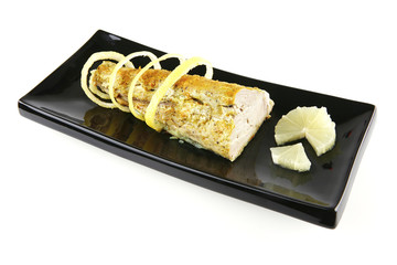 roast tuna with lemon on ceramic plate