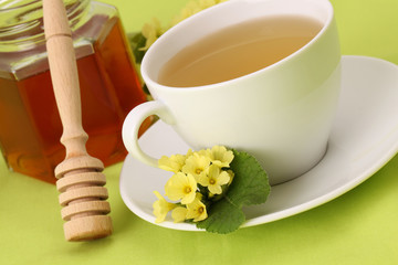 Herbal tea with primroses and honey