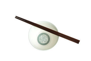 Isolated picture of chopsticks on a bowl
