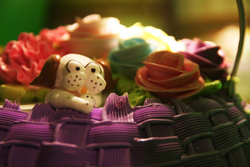Fototapeta premium delicious birthday cake on the table with the animal of the year
