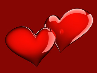 two glossy red hearts isolated on red