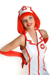 Beautiful funny  female doctor with red hair in medical uniform.