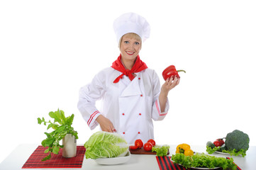 Chef with red pepper in her hand.