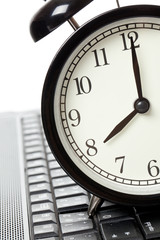 alarm clock and laptop