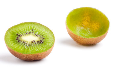 Two halves of kiwi fruit on white background.