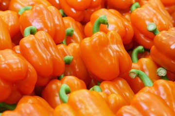 Fresh orange capsicum in a marketplace