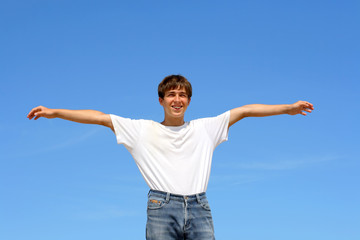 happy teenager on blue sky background
