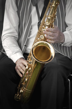 jazz saxophonist with color only on the instrument