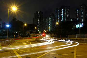 Fototapeta na wymiar High traffic road with motion blurred automobile