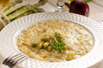 asparagus rice with fork on dish-riso agli asparagi
