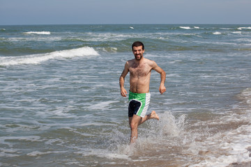 Fototapeta na wymiar man playing on the beach