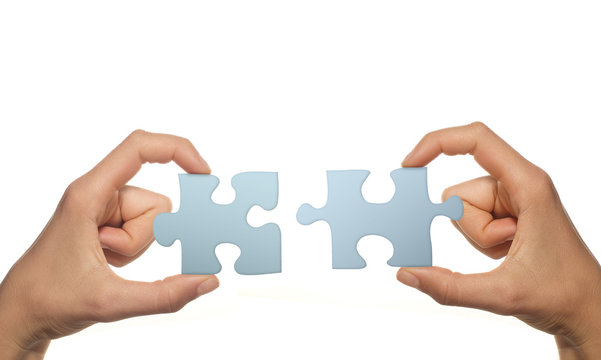 Teamspirit (Puzzleteile zusammenf&uuml;gen, wei&szlig;er Hintergrund)