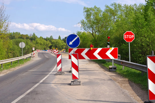 Road work, detour and road construction signs
