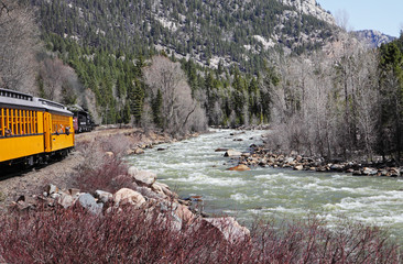 Narrow Gauge Steam Railway in Colorado USA with melting snow on