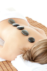 Close-up of relaxed woman lying on a massage table