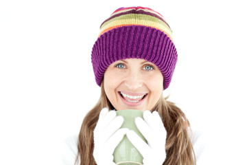 Happy woman holding a cup a coffee