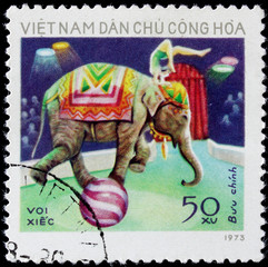post stamp shows people on elephant in circus