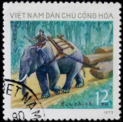 post stamp shows people on elephant