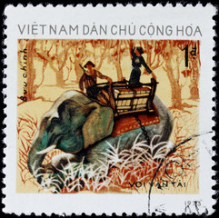 post stamp shows people on elephant