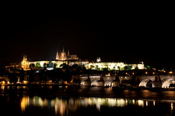 View on Charle`s bridge and St. Vitus Cathedral at night.