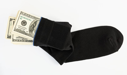 US dollars bundle hidden in black sock