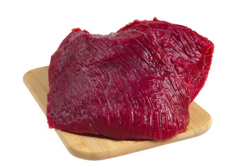 Beef on a wooden board