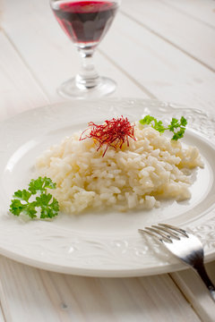 saffron rice on dish - riso allo zafferano