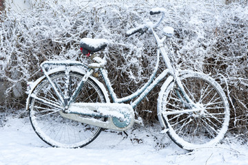 Bicycle coverd by snow in winter