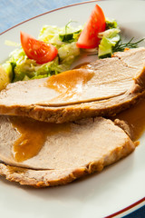 Roasted loin slices with vegetables