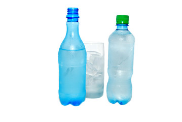 Two bottles with cold water and an ice in a glass