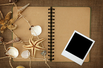 Fishing net and exercise book on brown background