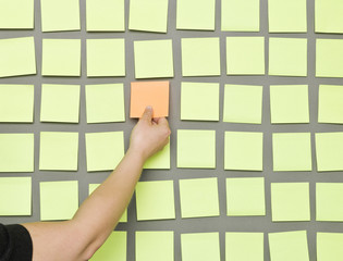 Human hand and Adhesive Notes