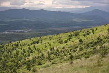 Fototapeta na wymiar Mountain landscape with green hills