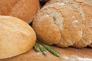 bread on a wooden board sprinkled with flour