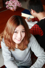 asian boy and girl studying in library